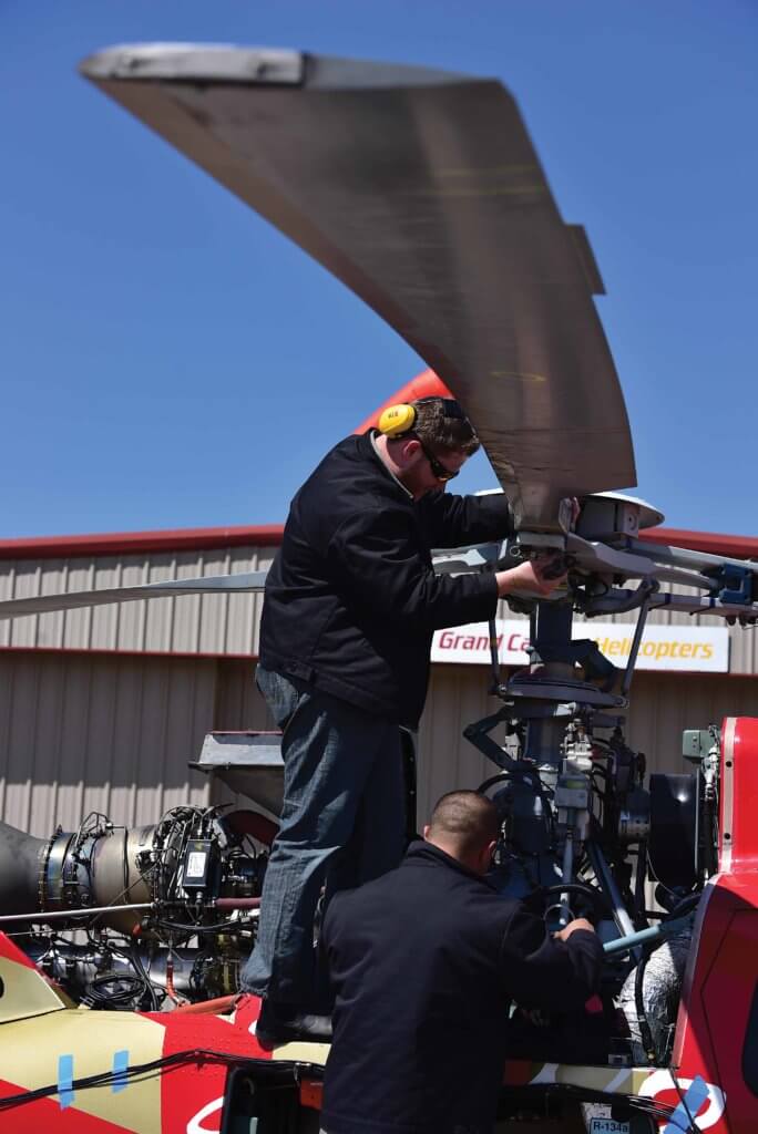 Mechanics working on main rotor hub